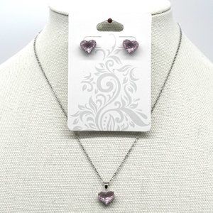 Necklace set with earrings and baby pink crystals.